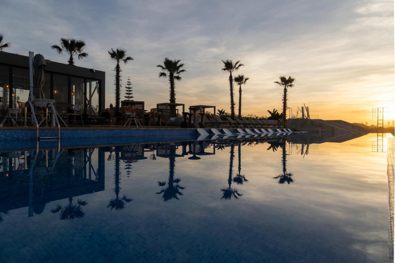풀만 마자간 로얄 골프 앤 스파 호텔 엘자디다 외부 사진 Sunset at the pool